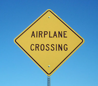 [Image: airplane-crossing-defensivedriving-street-signs.jpg]