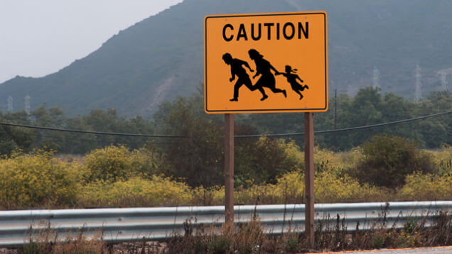 illegal-immigrant-crossing-street-sign-c
